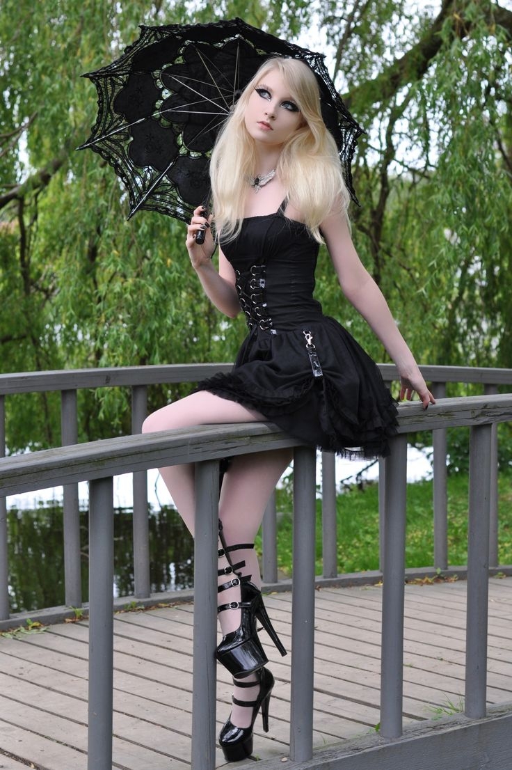 Blonde Gothic Girl with Bare Legs wearing Black Short Dress